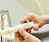 trim drip taper candle to fit wine bottle