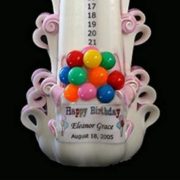 child's birthday candle with balloons