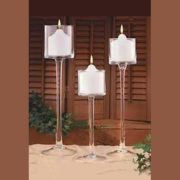 centerpiece uses 3" pillar candles in tall glass candle holders