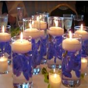 floating candle centerpiece with deep blue flowers