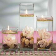 floating candles and orchids centerpiece