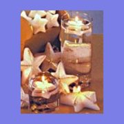 Glitter star floating candles in glass cylinders for sparkling centerpiece