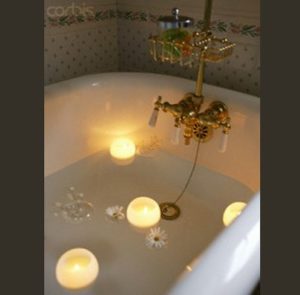 floating candles in a bathtub